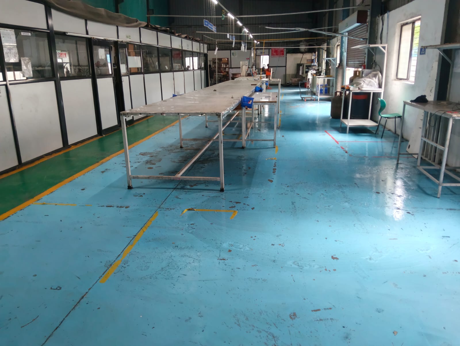E-Scedar India shop floor area with assembly workbenches and marked material flow lanes